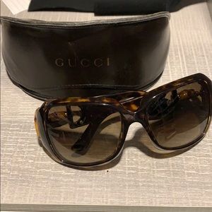 Tortoise shell Gucci sunglasses w bamboo detail.